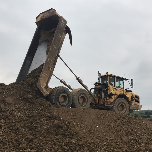 Soil being poured from a truck